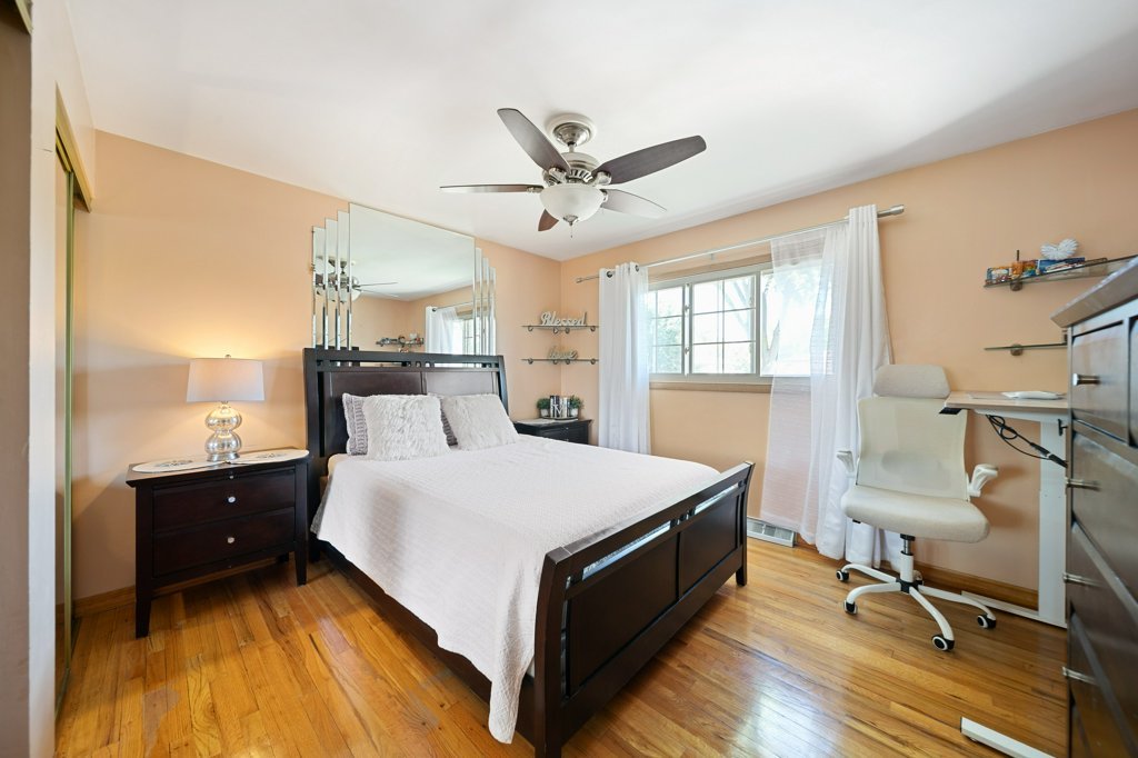 365 West Myrick Avenue Addison, IL 60101 - Photo 23 of 49 a bed room with a bed and a chandelier