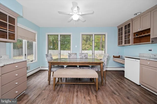 a view of a dining room with furniture window and wooden floor