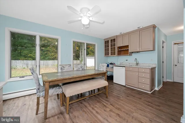 a kitchen with a stove a sink and a refrigerator
