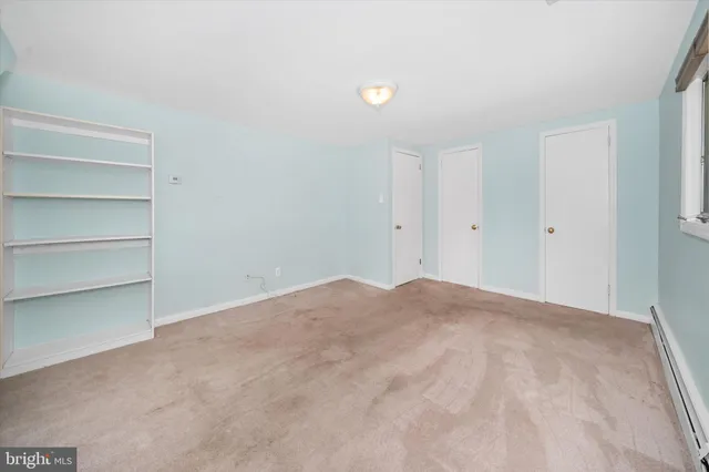 a view of an empty room with stairs