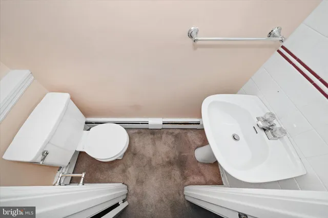 a utility room with cabinets dryer and washer