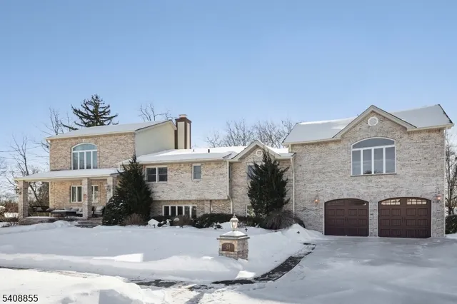 a view of an entryway livingroom and hall with wooden floor