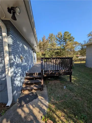 a view of a backyard with sitting area