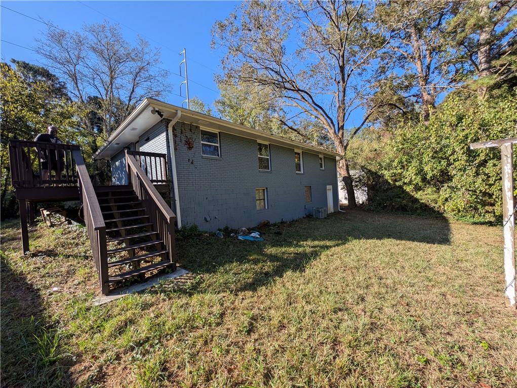 4328 Rockbridge Road Southwest Stone Mountain, GA 30083 - Photo 13 of 16 a view of a house with a yard