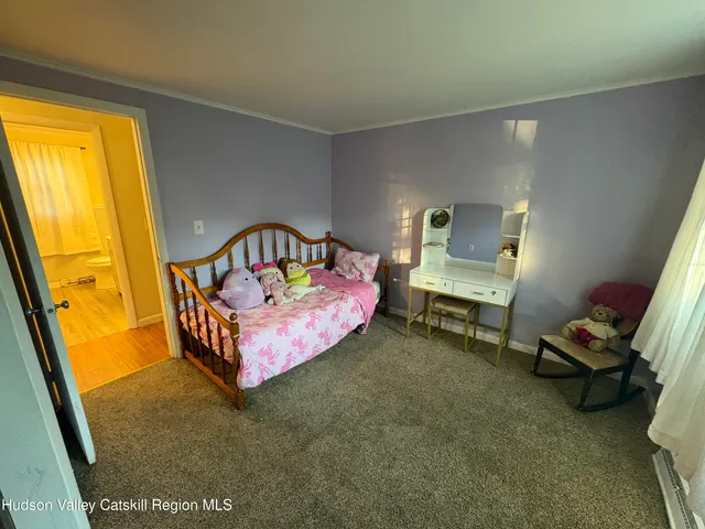 a bed room with furniture and a window