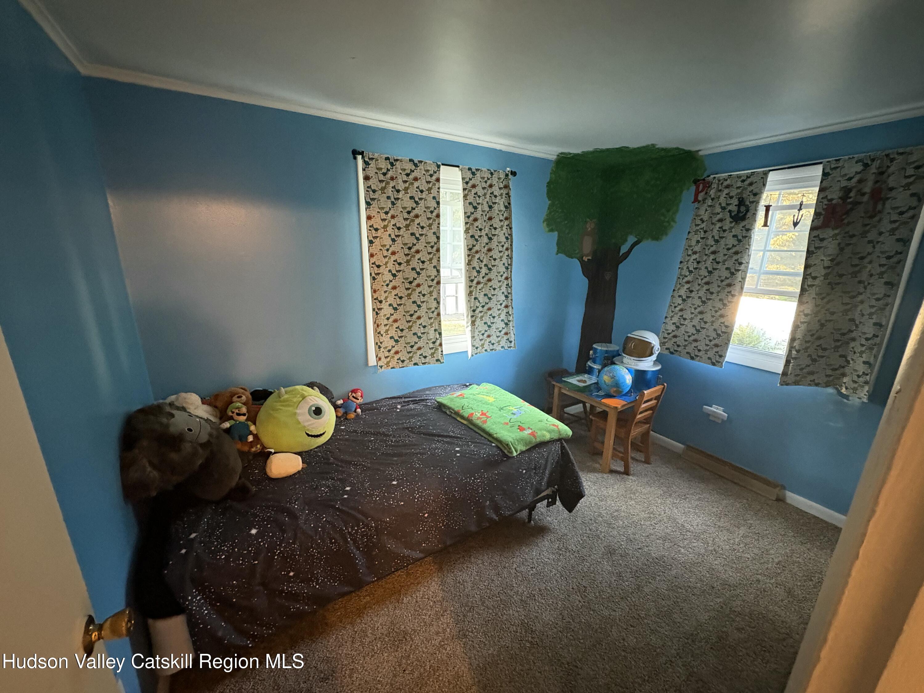 19 Rivenburg Lane Hudson, NY 12534 - Photo 16 of 28 a bedroom with a bed and a window