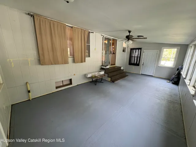a living room with furniture and windows