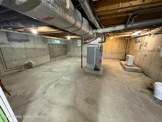 a view of empty room with wooden walls