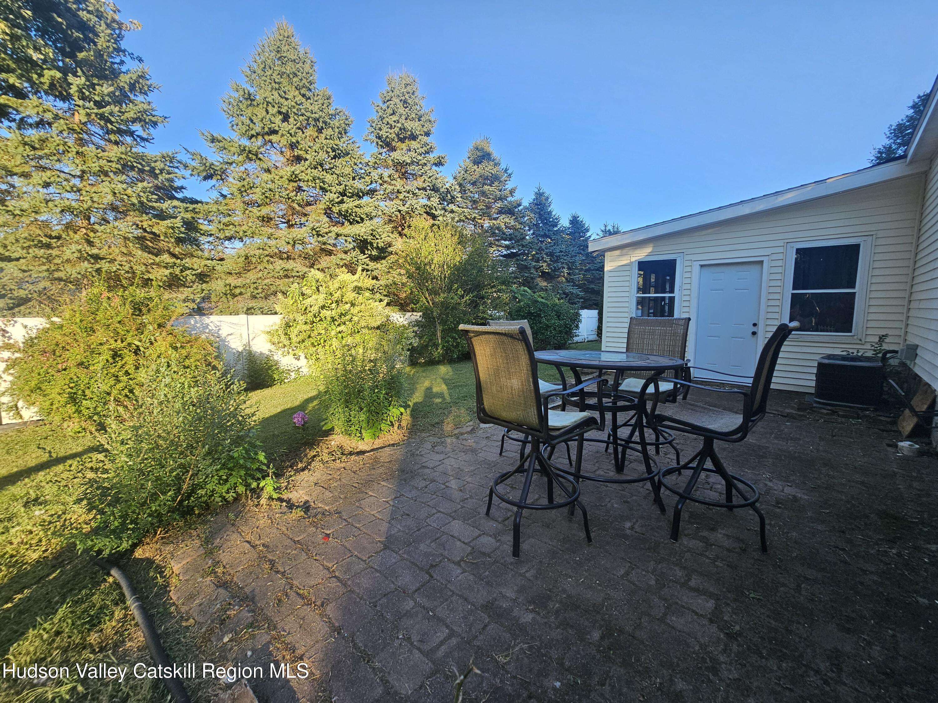 19 Rivenburg Lane Hudson, NY 12534 - Photo 25 of 28 a view of a backyard with furniture and a yard