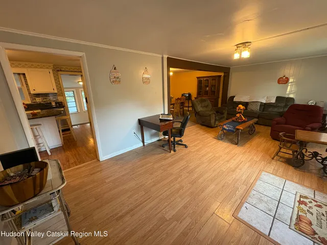 a room with furniture and wooden floor
