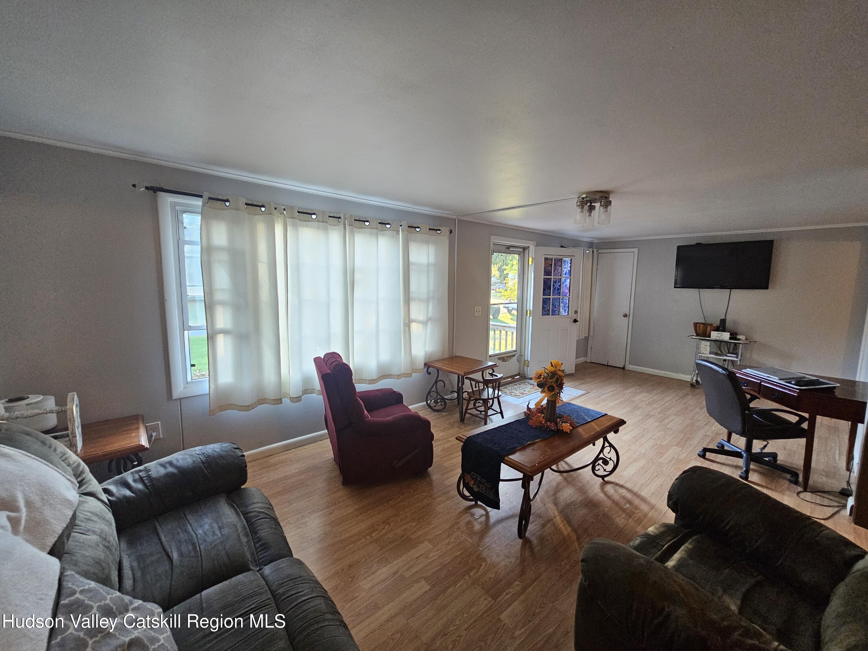 19 Rivenburg Lane Hudson, NY 12534 - Photo 6 of 28 a living room with furniture and a wooden floor