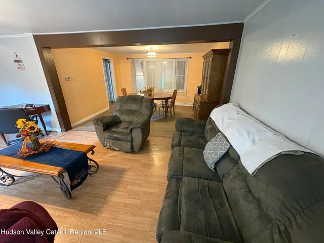 a living room with furniture and a table