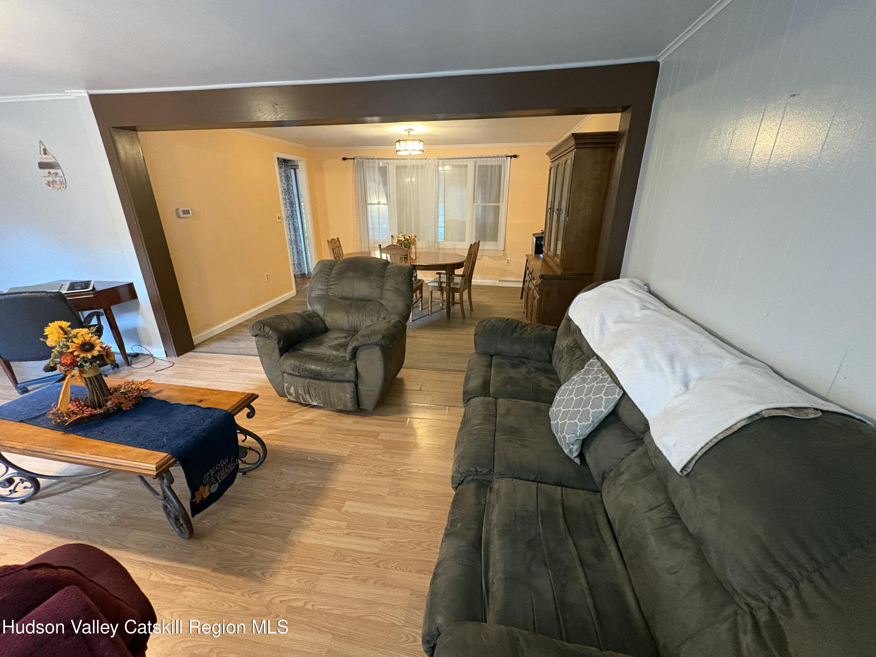 19 Rivenburg Lane Hudson, NY 12534 - Photo 7 of 28 a living room with furniture and a table