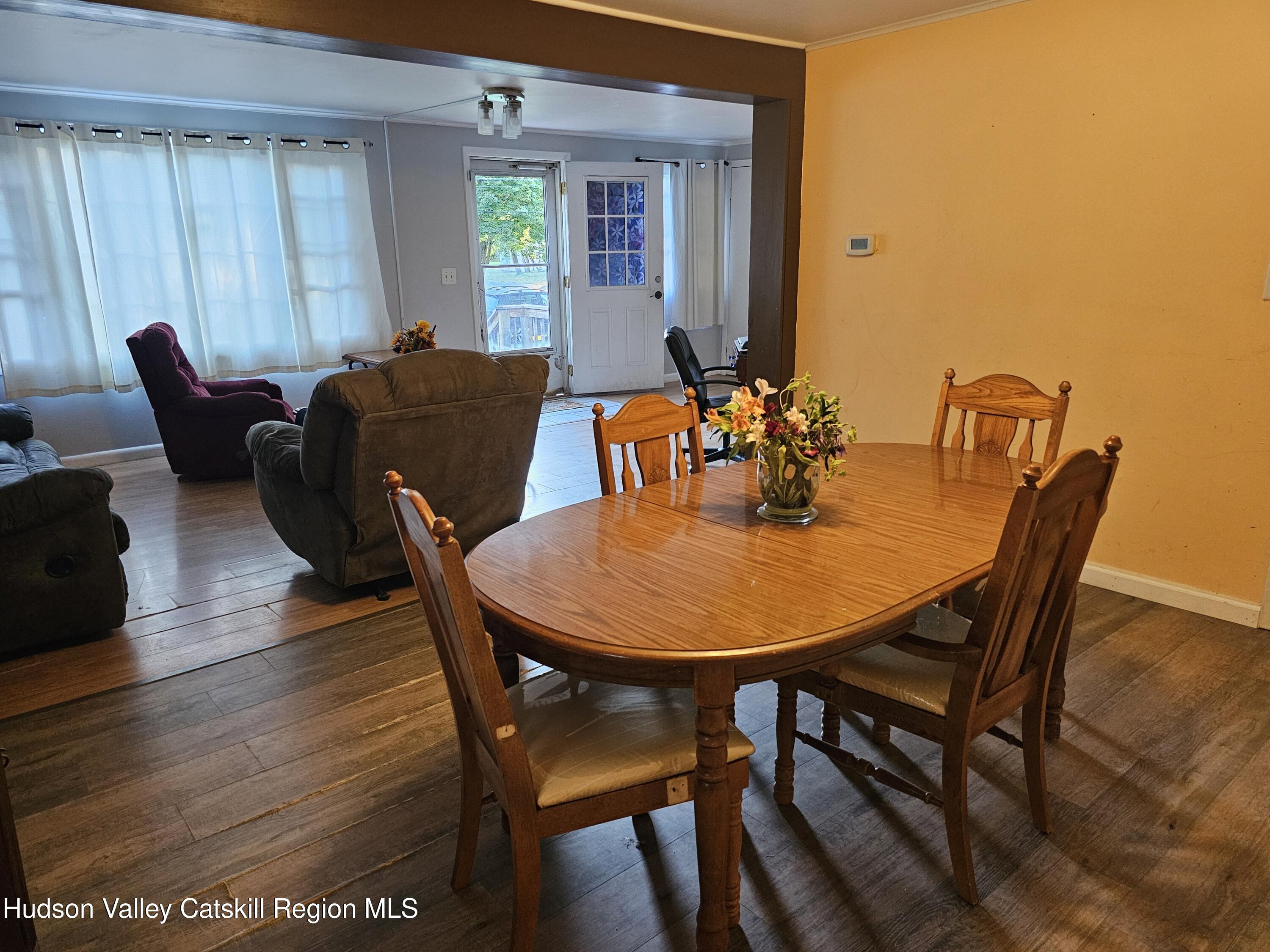 19 Rivenburg Lane Hudson, NY 12534 - Photo 8 of 28 a view of a dining room with furniture and window