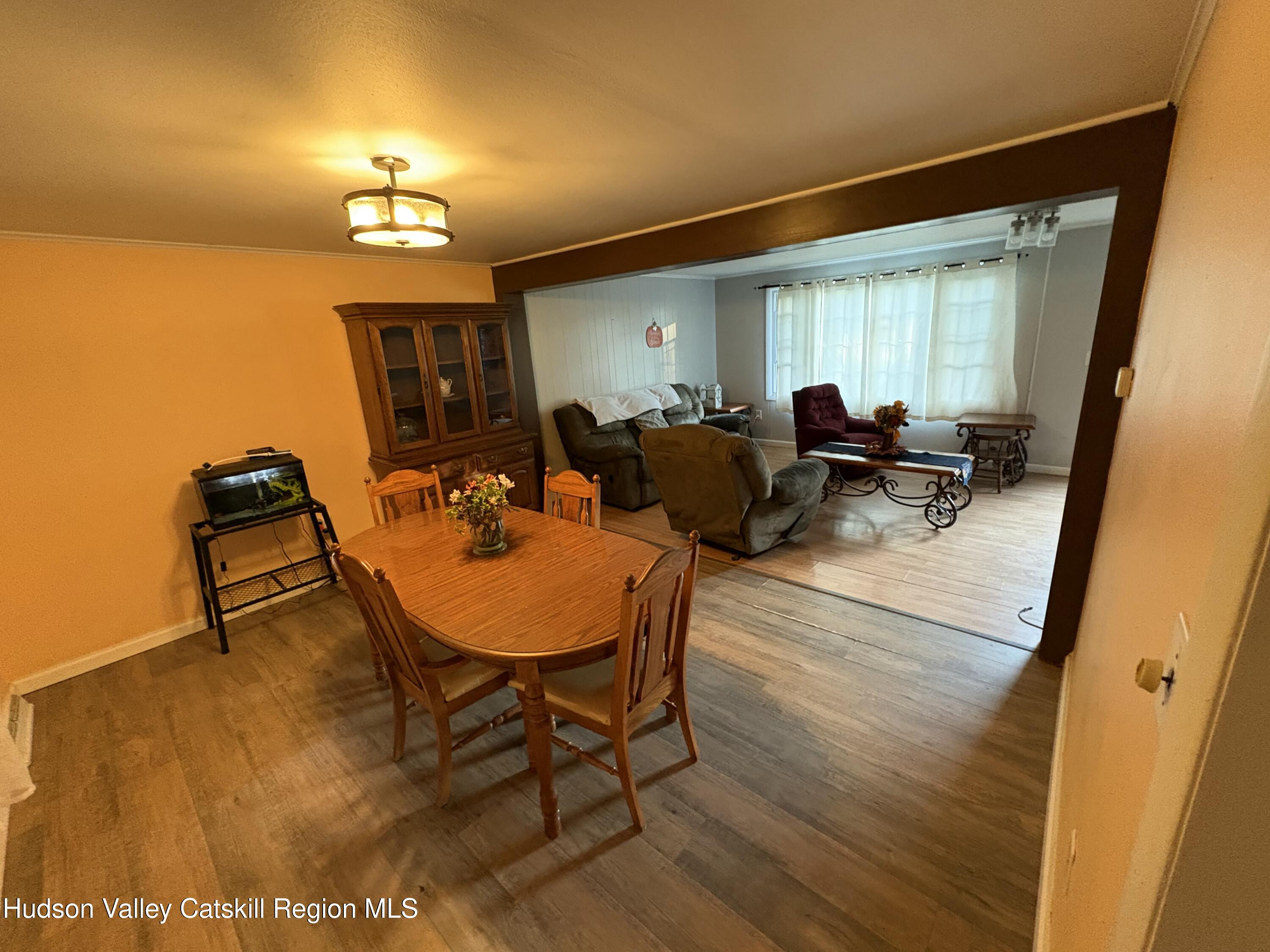 19 Rivenburg Lane Hudson, NY 12534 - Photo 9 of 28 a living room with furniture and a wooden floor