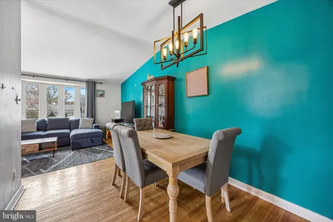 a view of a dining room with furniture and a window