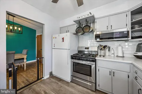 a kitchen with cabinets and steel stainless steel appliances