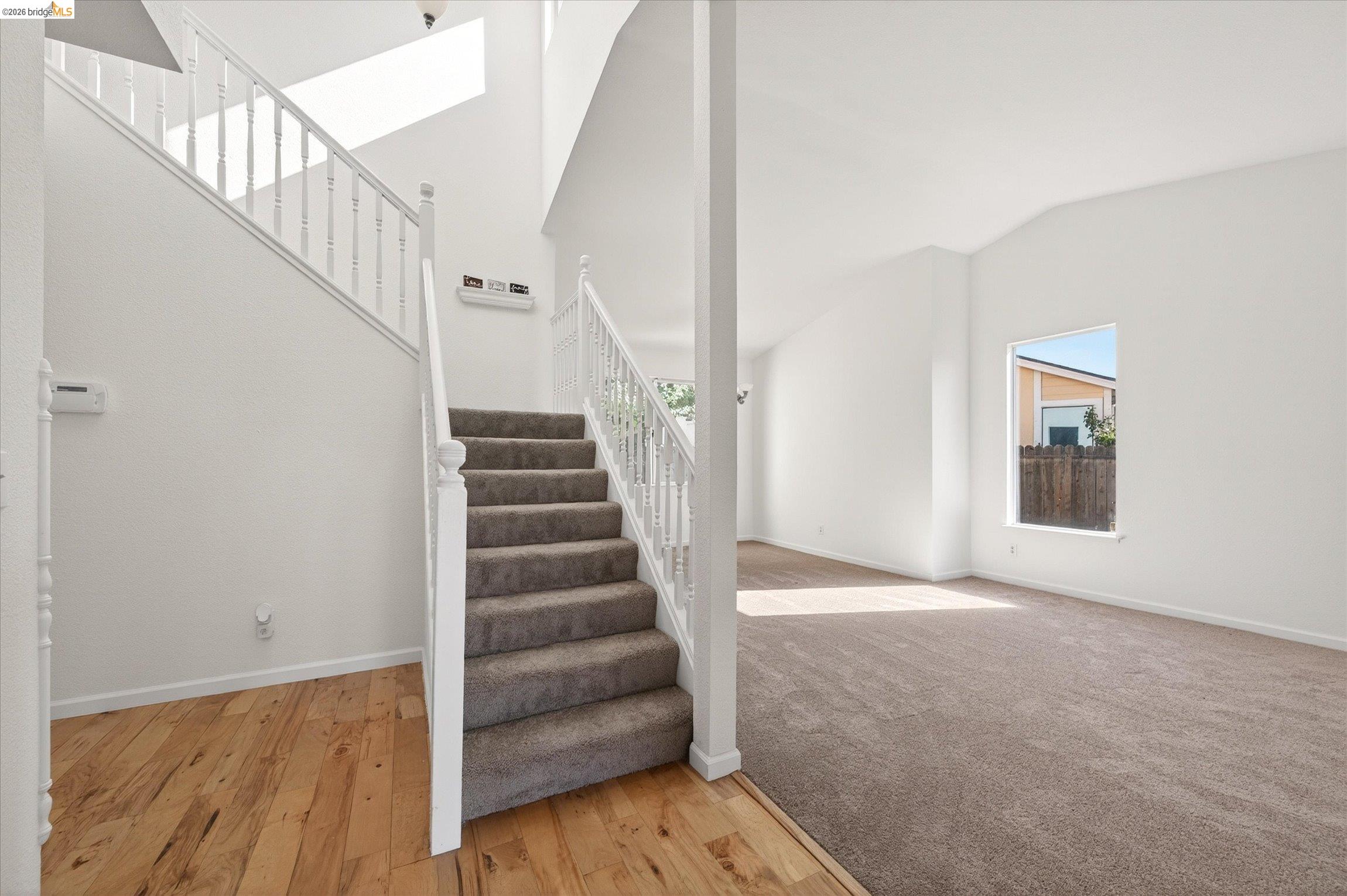1120 Deerpark Road Oakley, CA 94561 - Photo 6 of 30 Two-story staircase with white balusters and carpeted treads