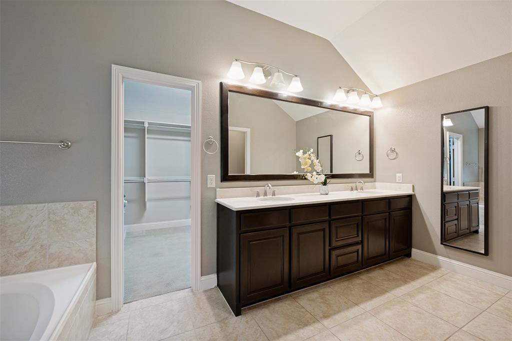773 South Coppell Road Coppell, TX 75019 - Photo 19 of 30 a bathroom with a double vanity sink and a mirror