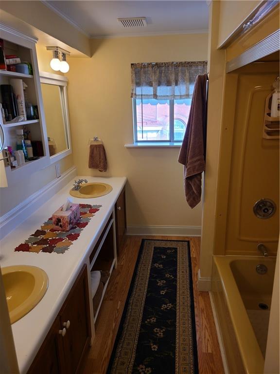 125 Butler Street Pittsburgh, PA 15209 - Photo 17 of 24 a bathroom with a sink a mirror and shower