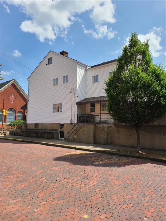 125 Butler Street Pittsburgh, PA 15209 - Photo 2 of 24 a front view of a house with a yard