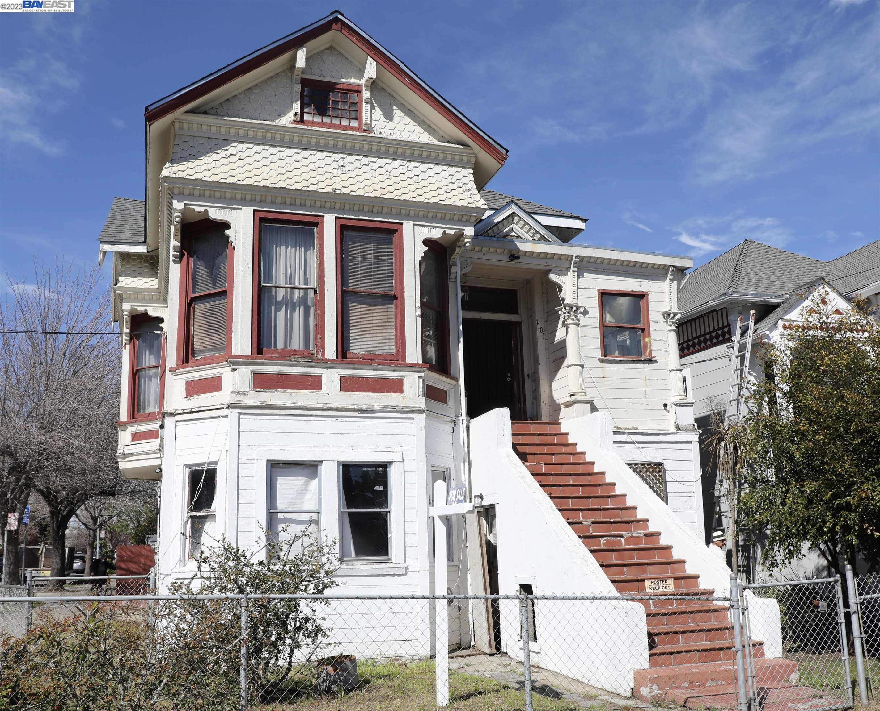 a front view of a residential houses with yard