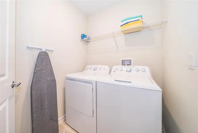 a utility room with dryer and washer