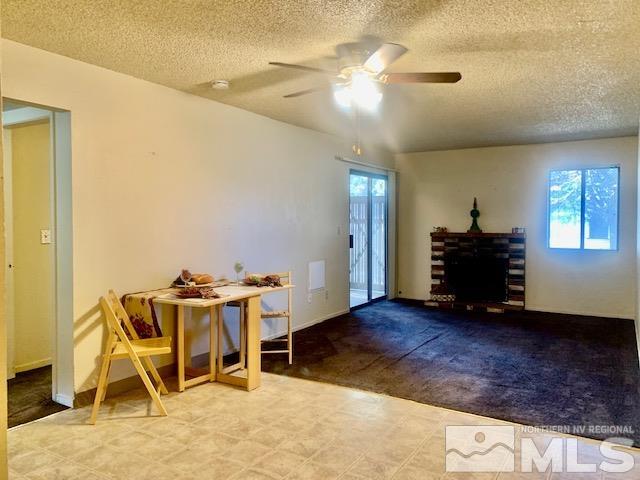 4480 Matich Drive Reno, NV 89502 - Photo 6 of 21 a view of a livingroom with furniture and a ceiling fan