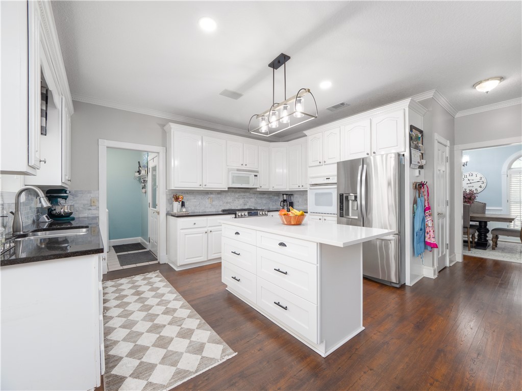202 Chesser Lane Folkston, GA 31537 - Photo 18 of 76 Heart of the home kitchen with a large island, granite countertops, and space to gather, cook, and make memories.