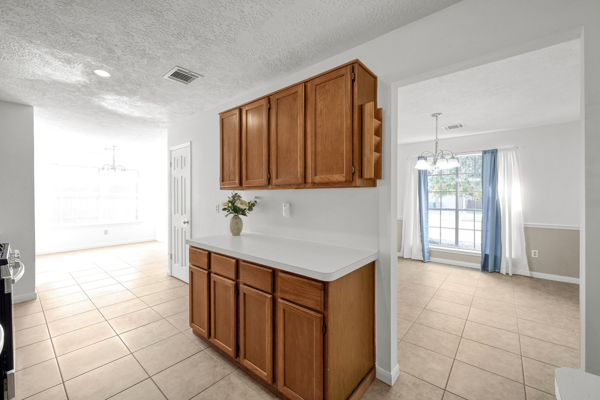 3406 Hartfield Lane Spring, TX 77388 - Photo 11 of 44 a kitchen with stainless steel appliances granite countertop a sink and cabinets