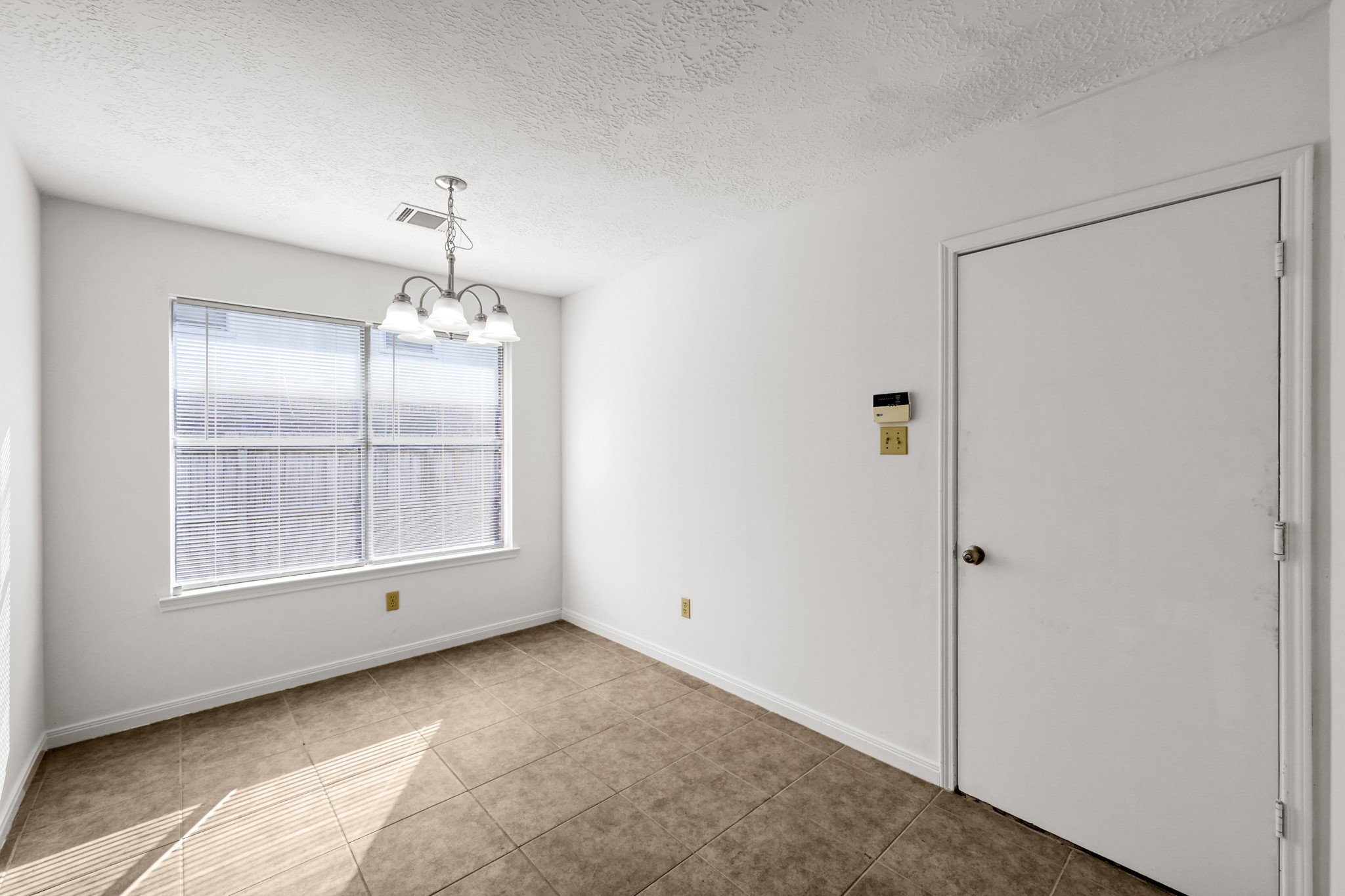 3406 Hartfield Lane Spring, TX 77388 - Photo 14 of 44 a view of empty room with wooden floor and fan