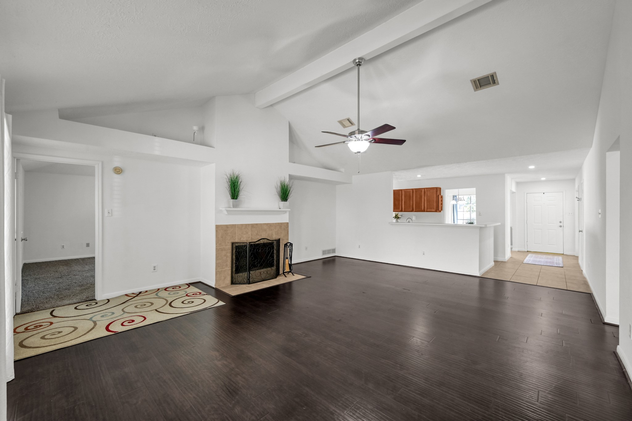 3406 Hartfield Lane Spring, TX 77388 - Photo 18 of 44 a view of an empty room with wooden floor fireplace and a window