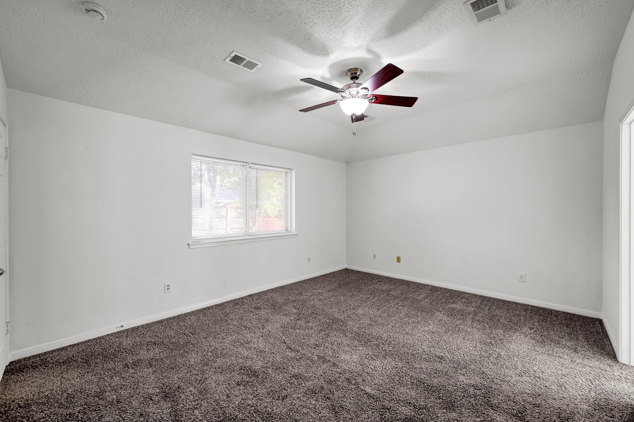 3406 Hartfield Lane Spring, TX 77388 - Photo 19 of 44 a view of a big room with carpet