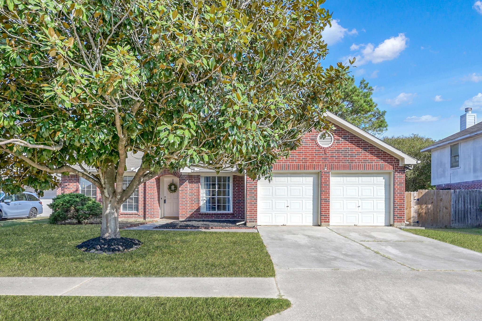 3406 Hartfield Lane Spring, TX 77388 - Photo 2 of 44 a front view of a house with a garden