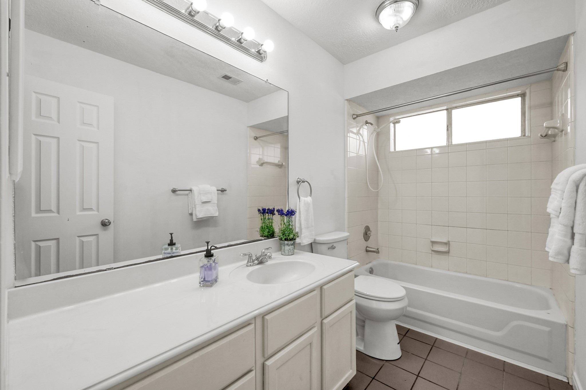 3406 Hartfield Lane Spring, TX 77388 - Photo 25 of 44 a bathroom with a sink a toilet and shower