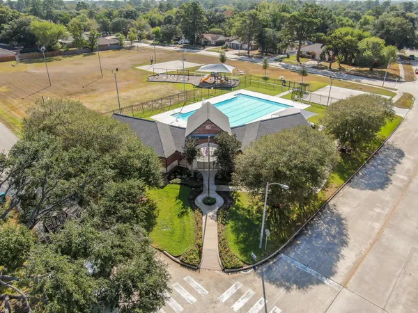 a view of a swimming pool with a yard