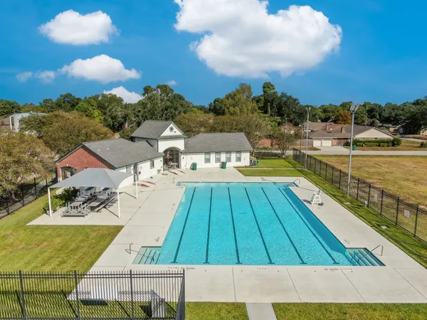 a view of swimming pool with lounge chair