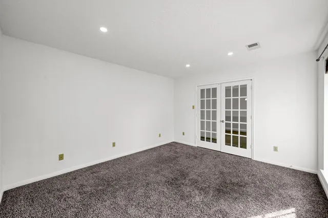 a kitchen with stainless steel appliances granite countertop a sink and cabinets