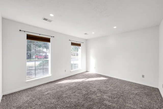 a kitchen with stainless steel appliances granite countertop a sink stove and microwave