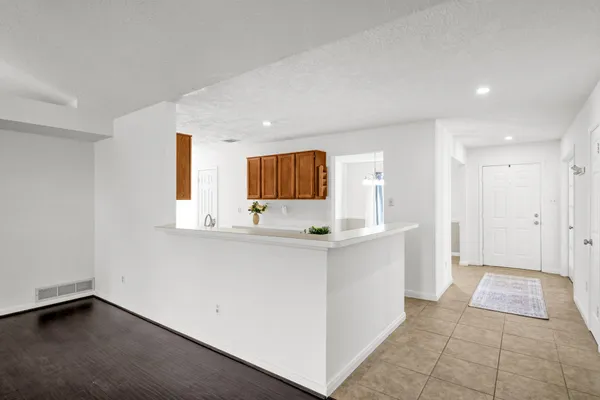 a view of kitchen with sink and window
