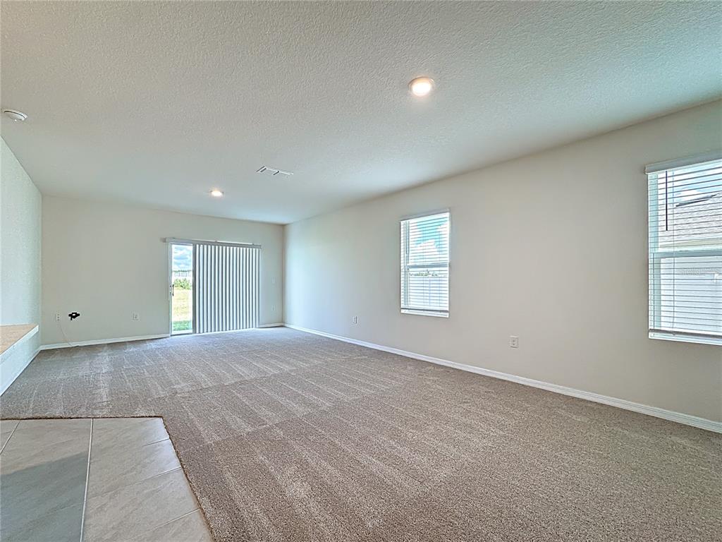 2692 Reddish Egret Bend, Unit 1 St. Cloud, FL 34773 - Photo 15 of 30 a view of an empty room with a window