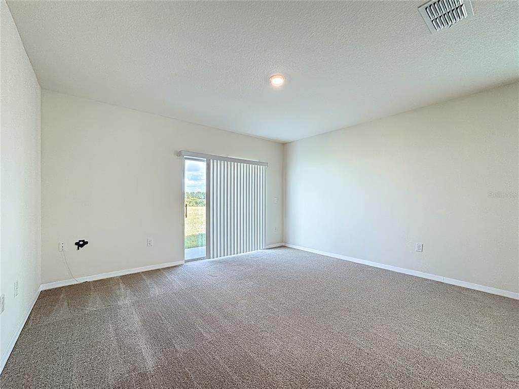2692 Reddish Egret Bend, Unit 1 St. Cloud, FL 34773 - Photo 16 of 30 a view of an empty room with window