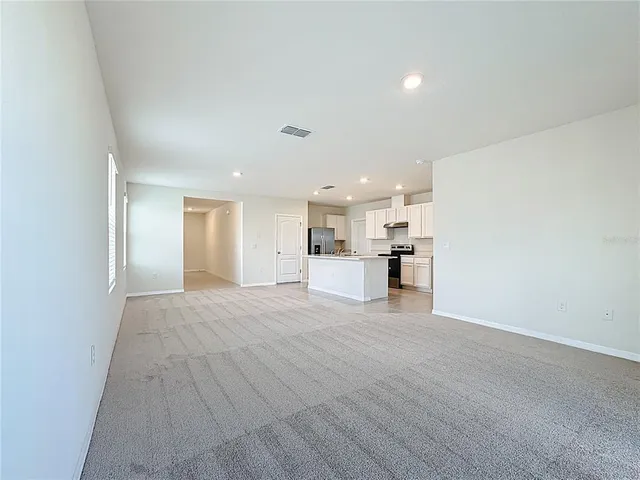 a view of a kitchen with a sink and cabinets