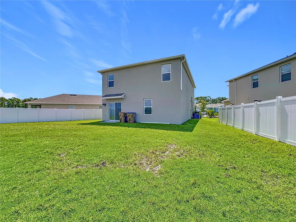 2692 Reddish Egret Bend, Unit 1 St. Cloud, FL 34773 - Photo 30 of 30 a house view with swimming pool in front of it