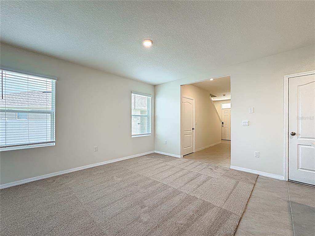 2692 Reddish Egret Bend, Unit 1 St. Cloud, FL 34773 - Photo 4 of 30 an empty room with windows and closet