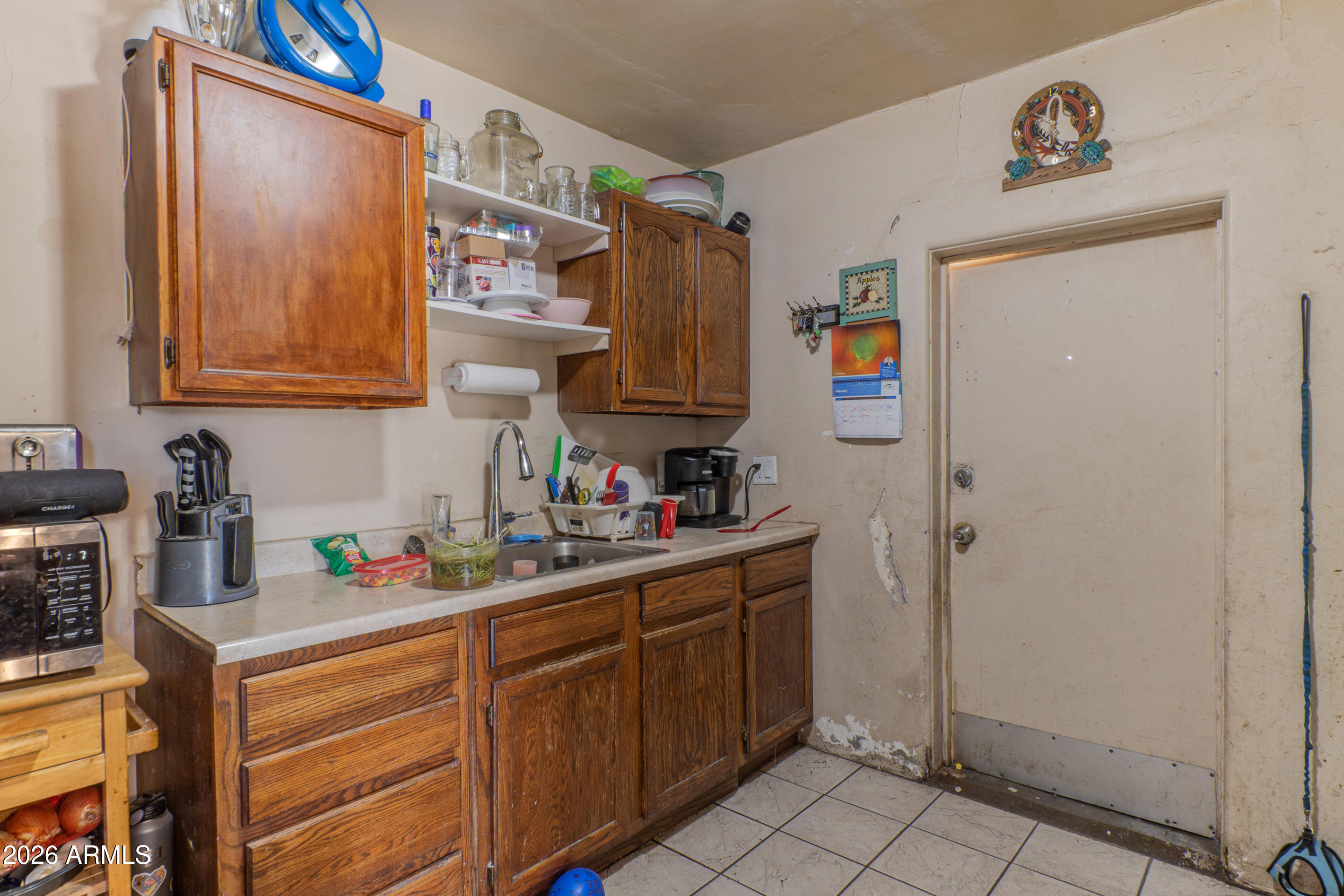 2916 East Monroe Street Phoenix, AZ 85034 - Photo 11 of 11 a kitchen with stainless steel appliances a refrigerator and sink