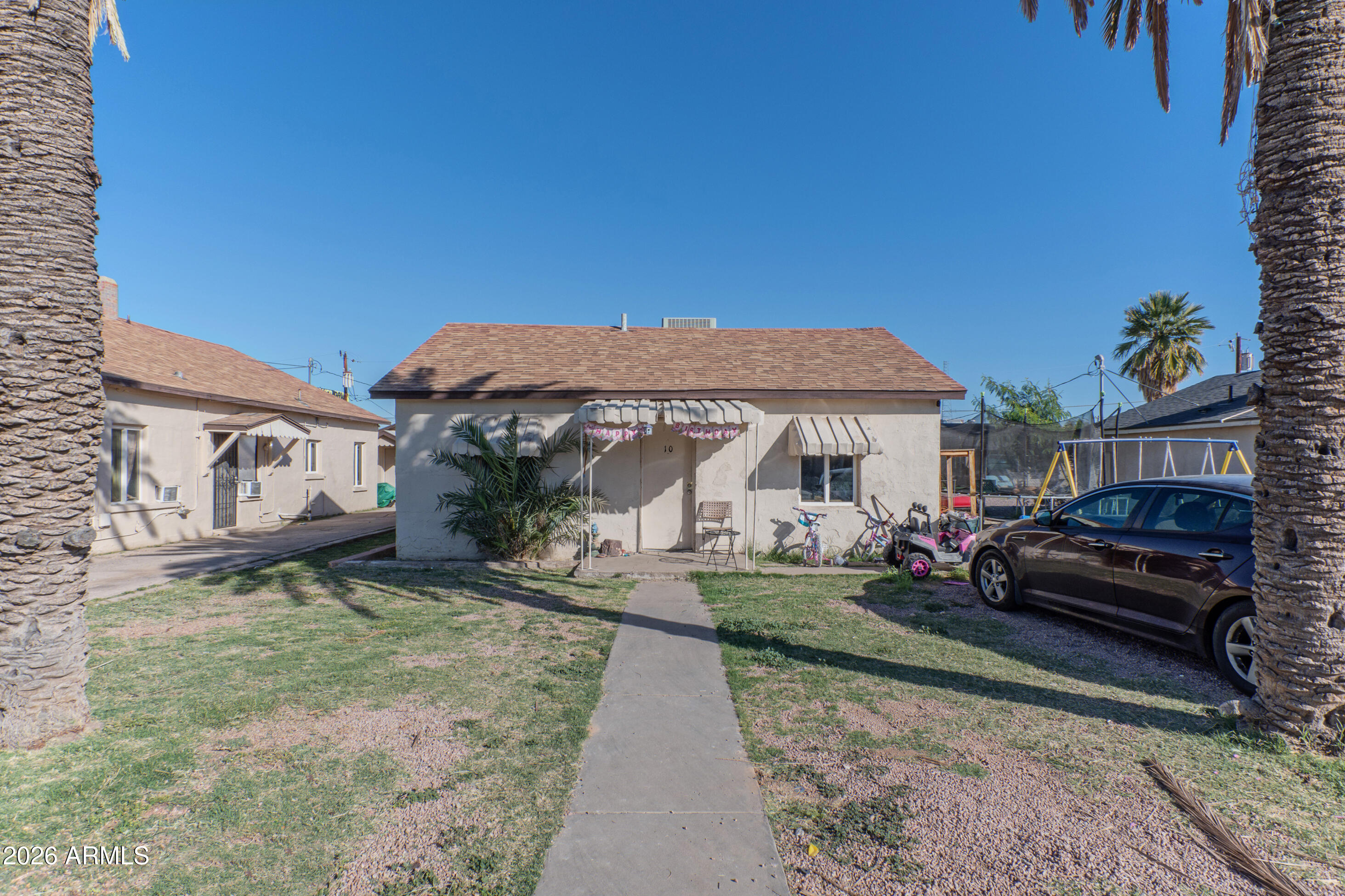 2916 East Monroe Street Phoenix, AZ 85034 - Photo 9 of 11 a front view of a house with garden