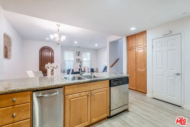 a kitchen with sink and window