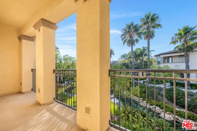 a balcony with small garden view