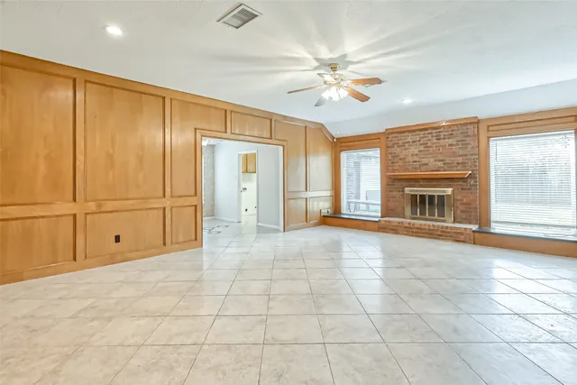 a view of an empty room with a fireplace